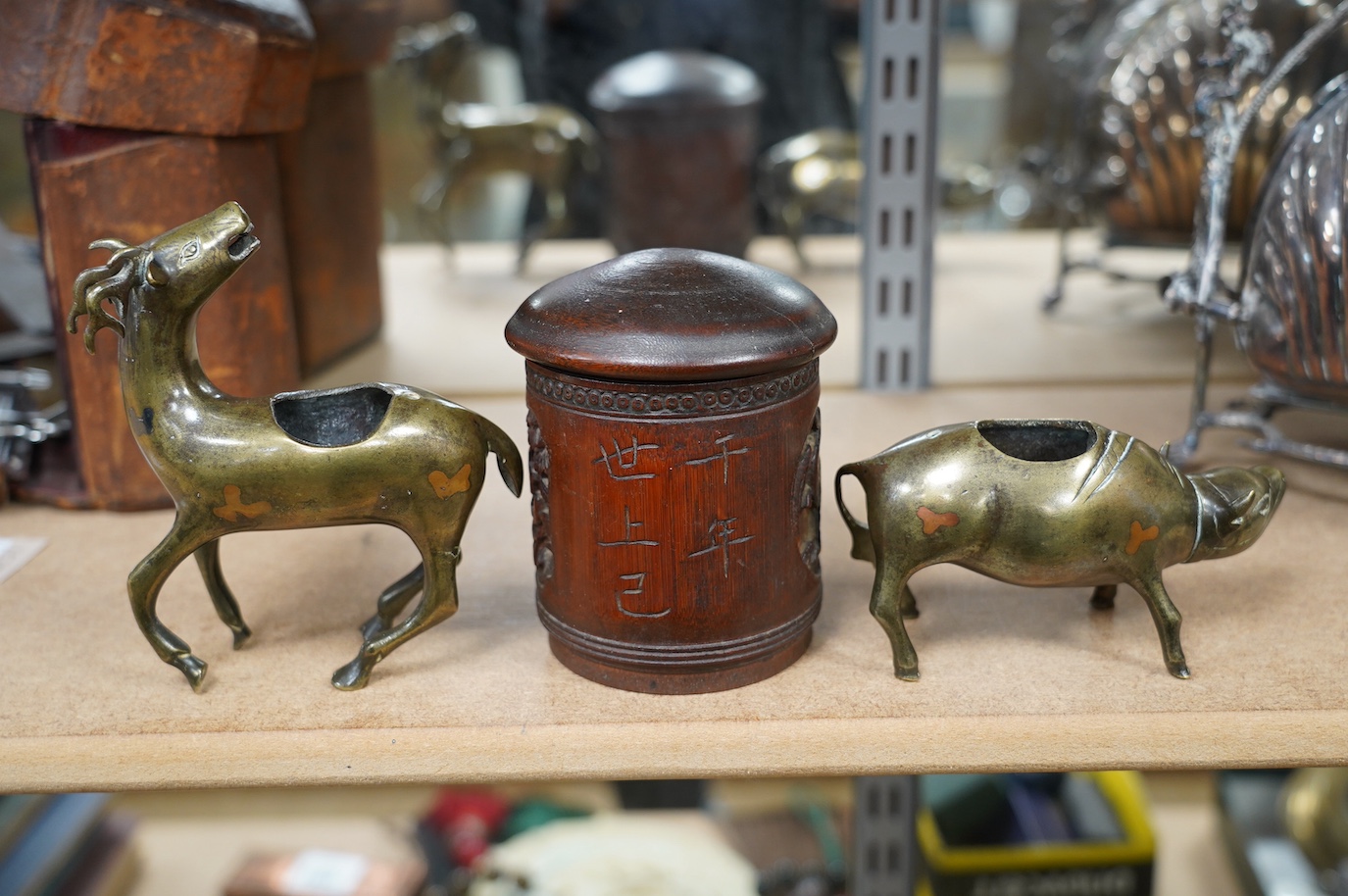 Two 19th century Chinese bronze, copper and silver inlaid censers in the form of animals and a bamboo tea caddy, largest 14cm high. Condition - fair